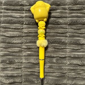 Cheerful Yellow Pen with Fun Character Top